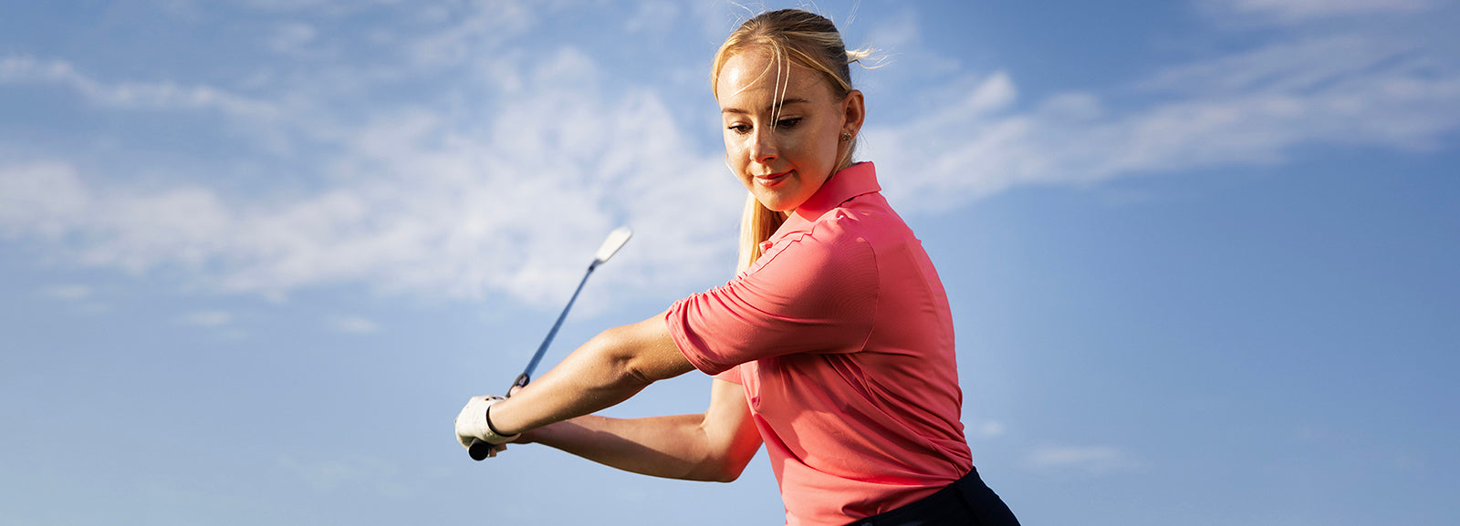 Golfer in ruched half sleeve polo in Pink Lemonade from FootJoy at GolfGarb