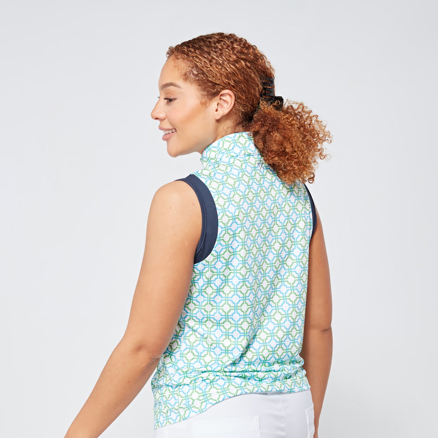 Swing Out Sister Ladies Sleeveless Zip-Neck Polo in Dazzling Blue and Emerald Mosaic Pattern