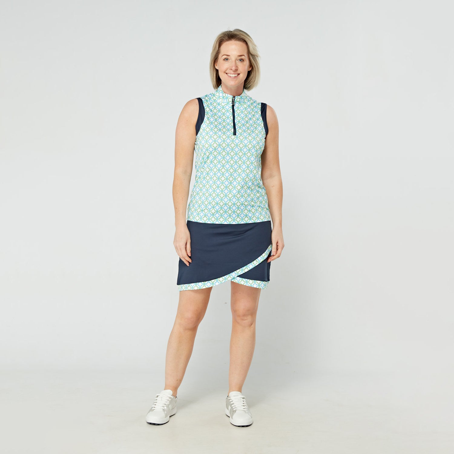 Swing Out Sister Ladies Sleeveless Zip-Neck Polo in Dazzling Blue and Emerald Mosaic Pattern