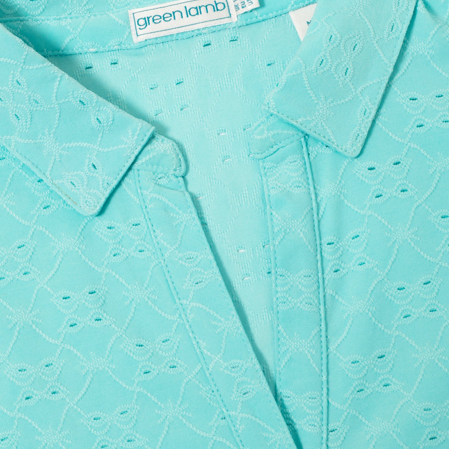 Green Lamb Ladies Sleeveless Polo with Broderie Anglaise Pattern in Aqua