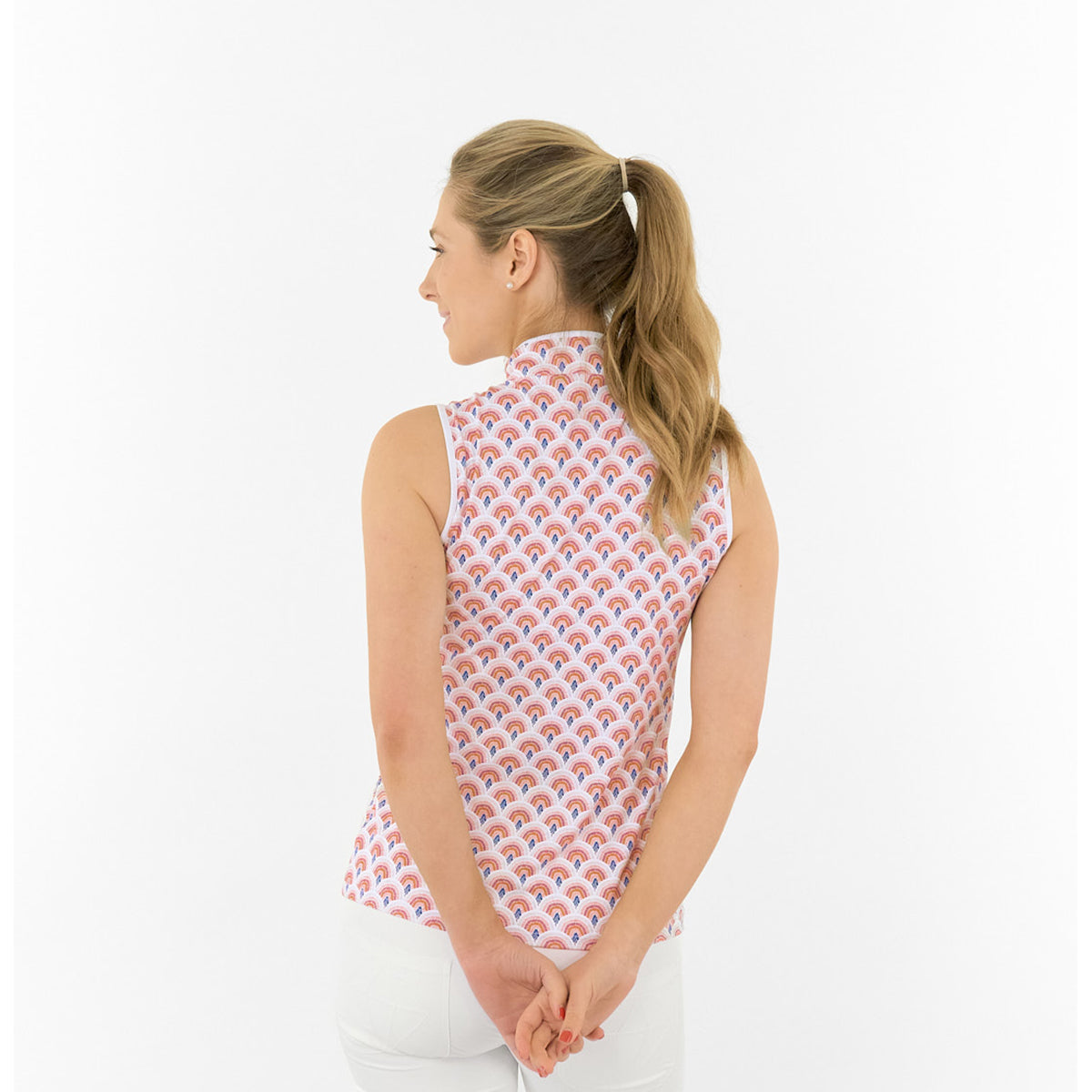 Pure Golf Ladies Sleeveless Polo in Rainbow Geo Print – Dynamic Design Meets Effortless Performance