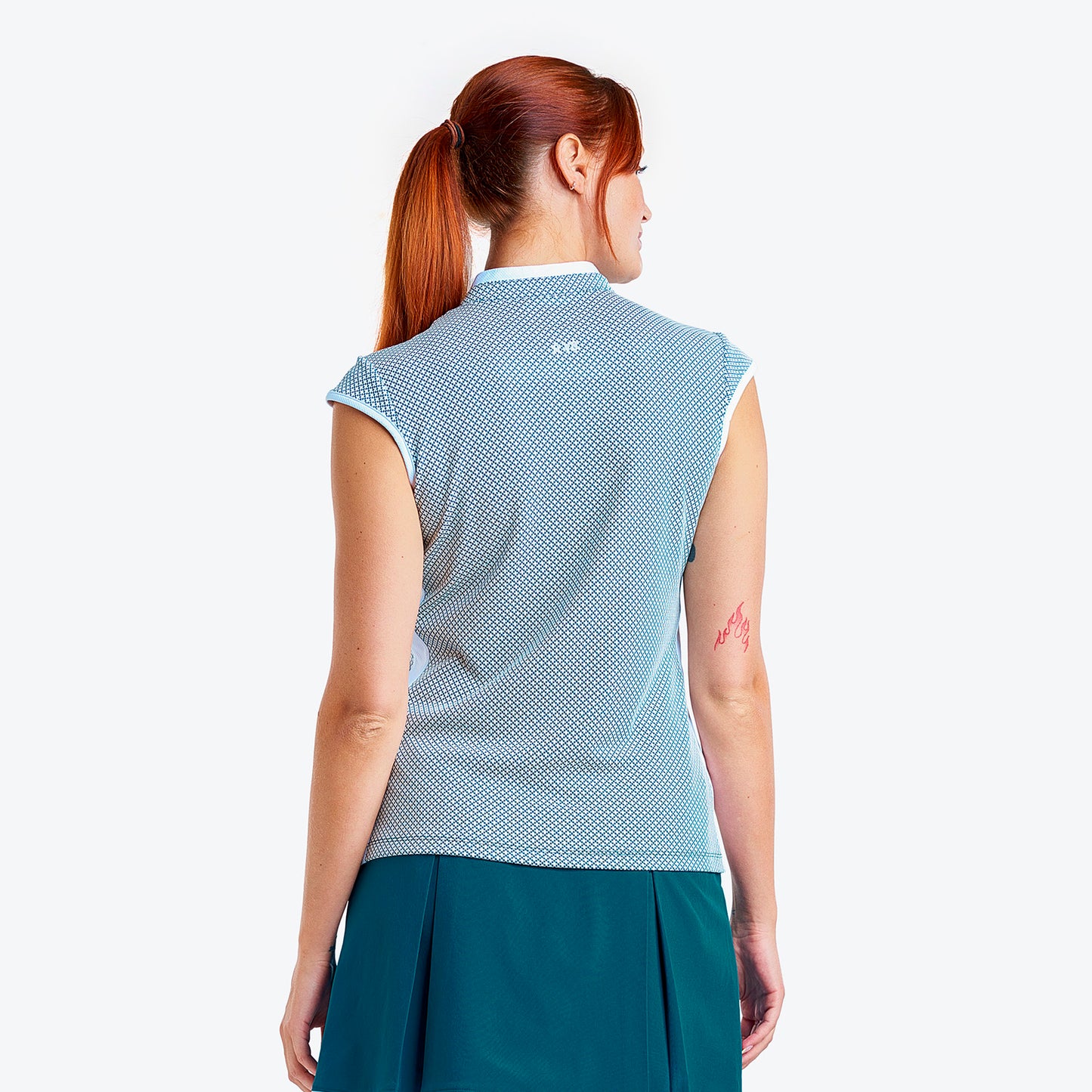 Nivo Ladies Sleeveless Mock in Legion Blue with Cross Stitch Pattern