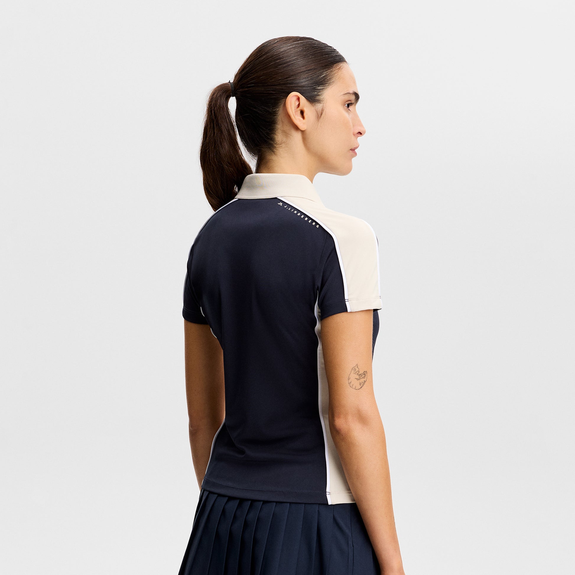 J.Lindeberg Ladies Navy Short Sleeve Polo - Feminine Fit, Confident Swing