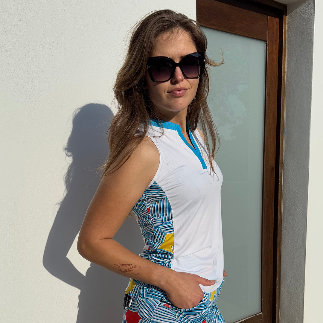Model wearing swing out sister womens white golf polo with open v neck and print side panels available at golfgarb