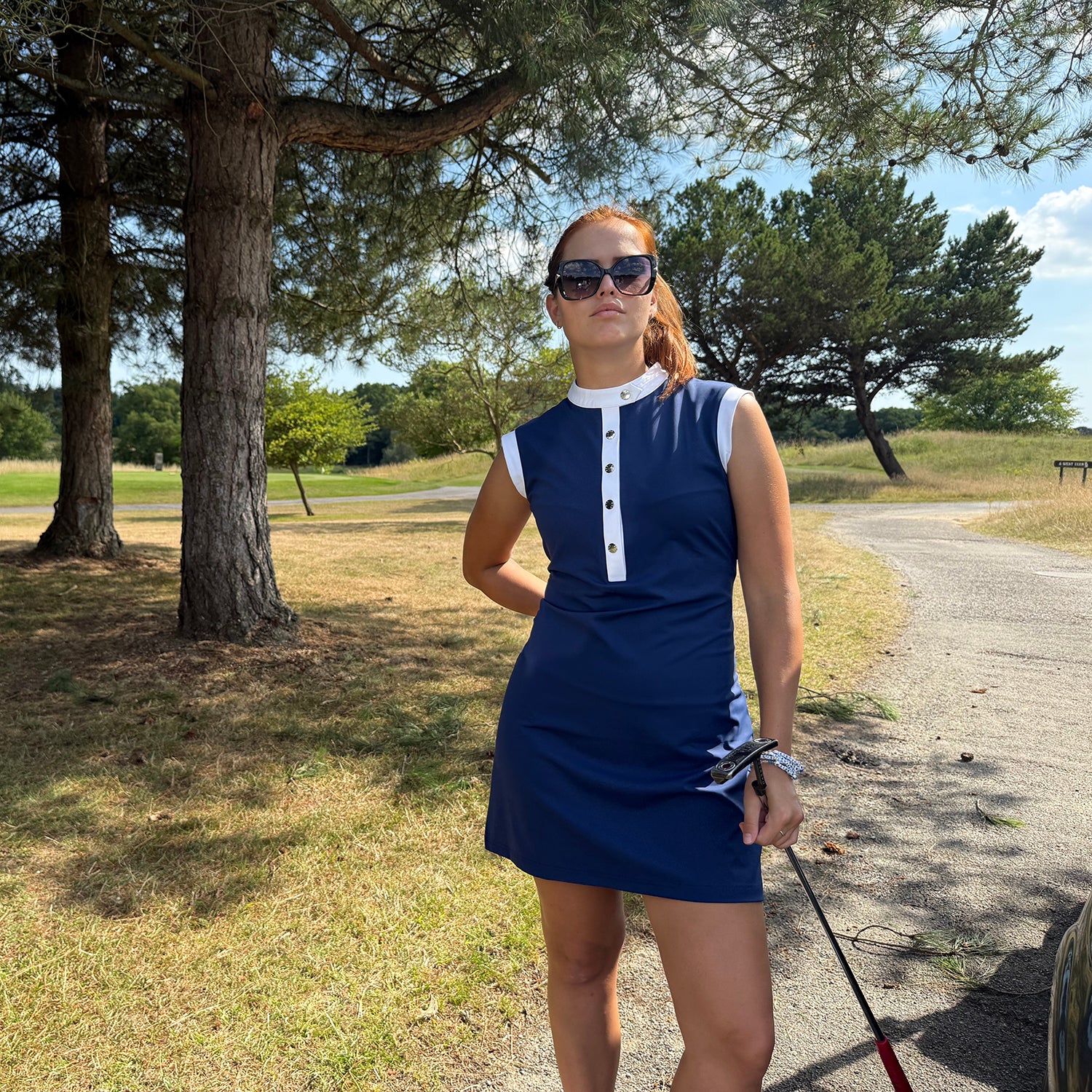 Swing Out Sister Navy Ladies Sleeveless Dress with Elegant Neckline & Standout Contrast Trim