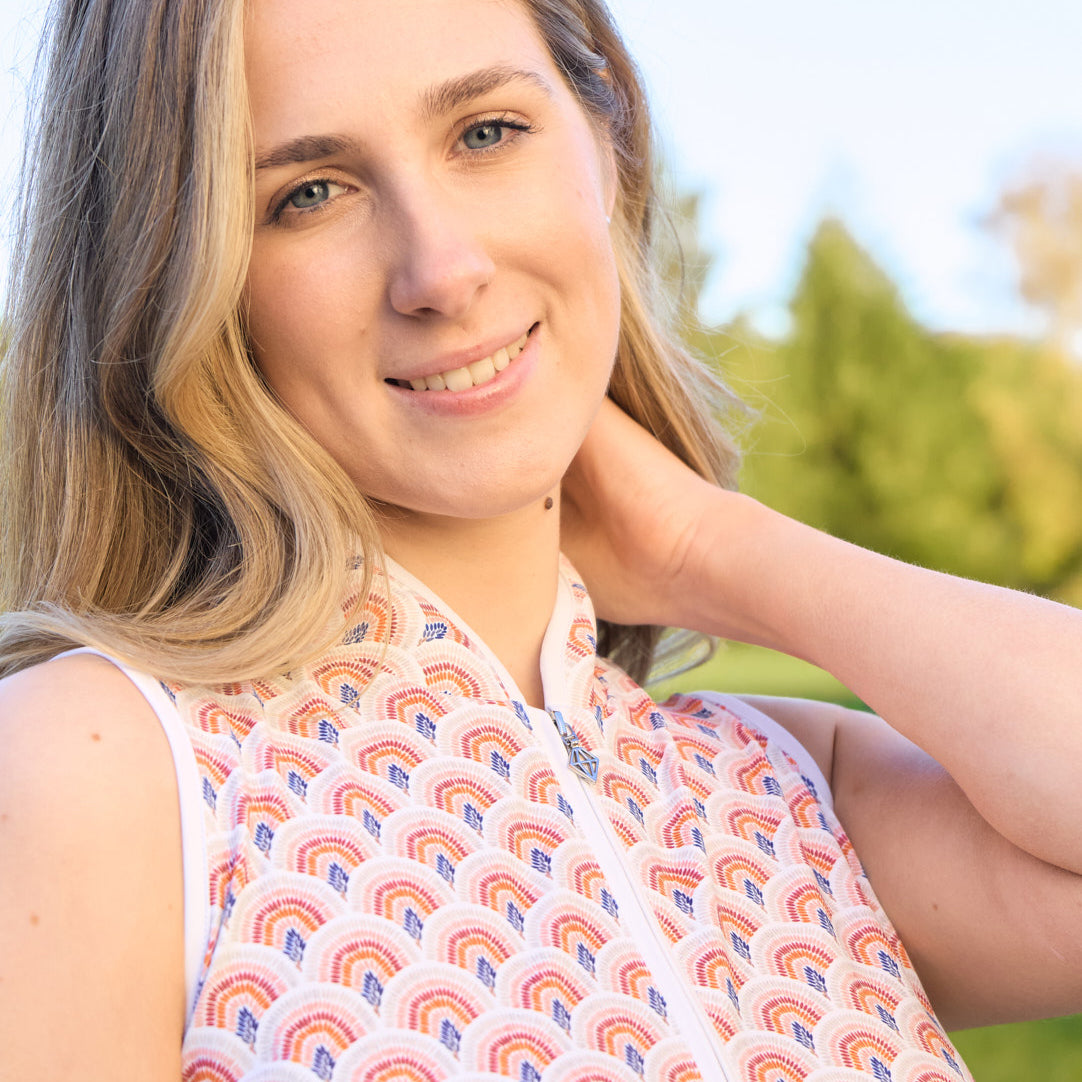 Pure Golf Ladies Sleeveless Polo in Rainbow Geo Print – Dynamic Design Meets Effortless Performance