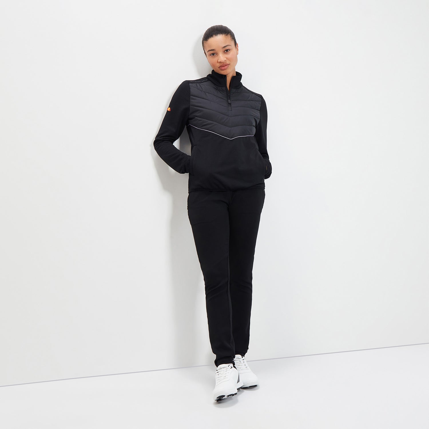 Ellesse Ladies Soft-Stretch Jacket with 1/4 Zip Neck and Quilted Panels in Black