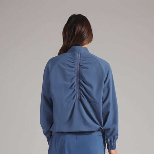 Puma Ladies Golf Wind Jacket Functional & Feminine with Swing Ready Back Detail