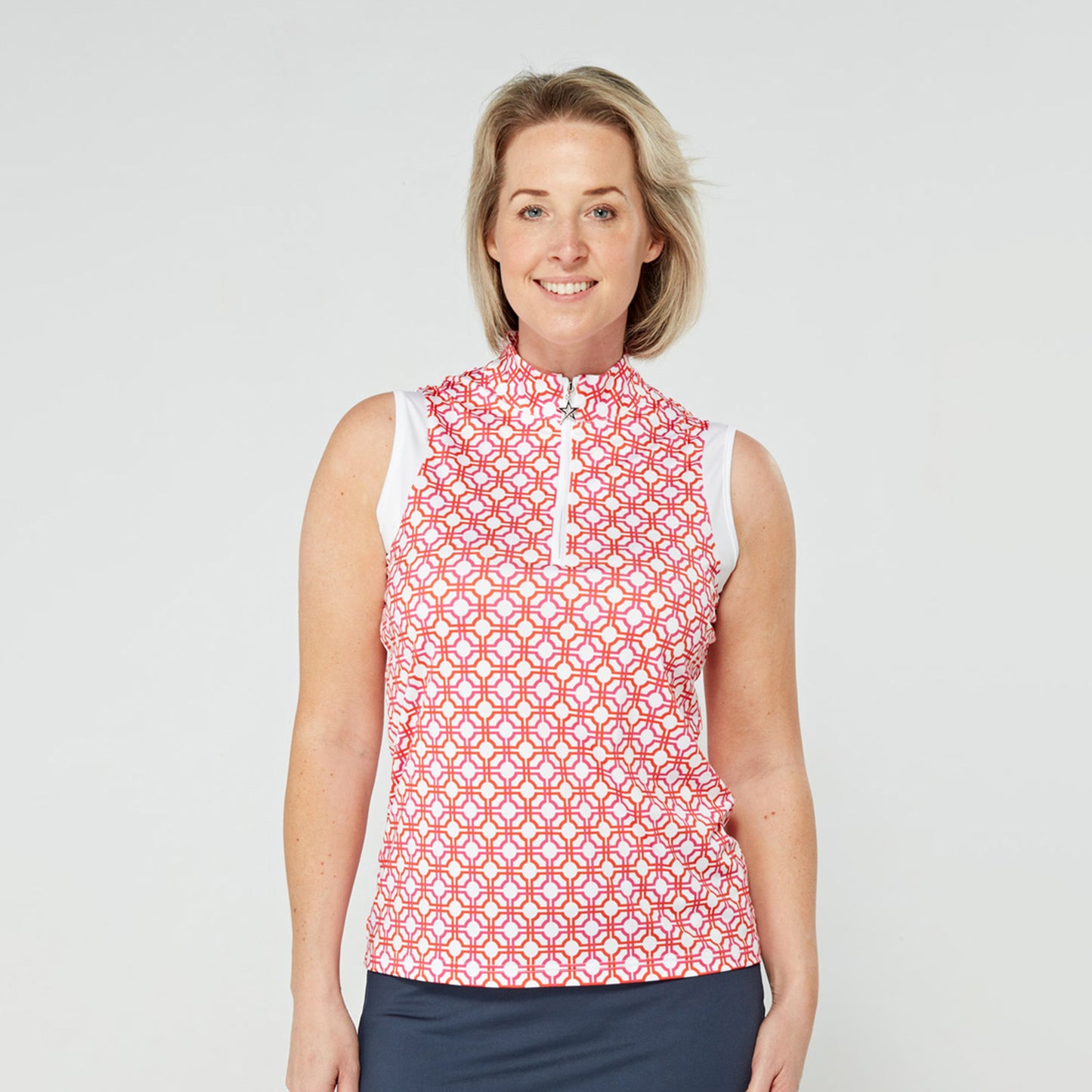 Swing Out Sister Sleeveless Zip-Neck Polo in Lush Pink and Mandarin Mosaic Print